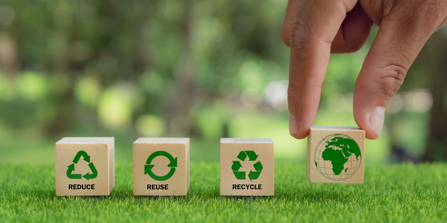 hand arranged wooden cube block over reduce, reuse and recycle text for save world, environmental concept